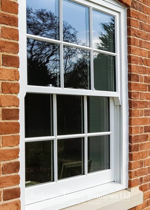 Joiner repairing original timber sash and case window components
